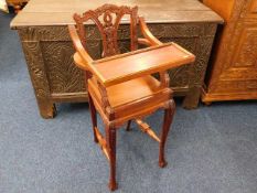 An early 20thC. carved childs high chair
