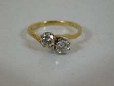 An 18ct gold ring with two 0.25ct diamonds of fine