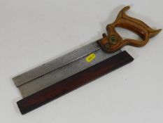 A US Disston hand saw with blade guard