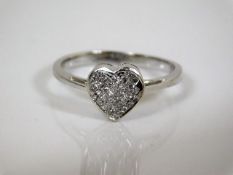 A heart shaped 18ct gold diamond ring