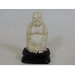 An early 20thC. Oriental Buddha figure on plinth 3