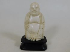 An early 20thC. Oriental Buddha figure on plinth 3