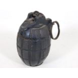 A trench art hand grenade money box