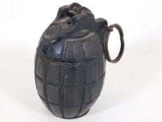 A trench art hand grenade money box