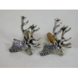 A pair of white metal stag cufflinks