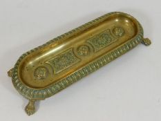 A Georgian brass pen holder