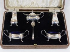 A cased silver cruet set