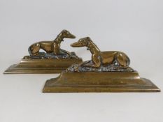 A pair of 19thC. brass running dog mantle ends