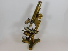 An antique R & J Beck of London brass microscope