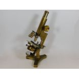 An antique R & J Beck of London brass microscope