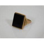 An art deco 9ct gold ring set with onyx