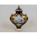 A Royal Crown Derby lidded vase with hand painted
