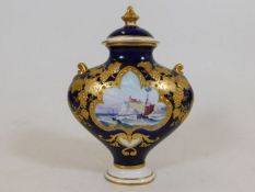 A Royal Crown Derby lidded vase with hand painted
