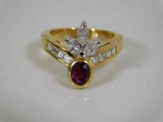 An 18ct ring set with approx. 1.5ct diamonds & 0.5ct ruby