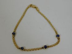 An 18ct gold bracelet set with four sapphires