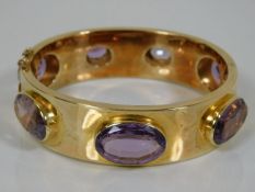 A substantial Victorian 9ct gold & amethyst bangle