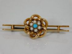 A yellow metal Victorian brooch set with turquoise