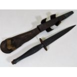 A Fairbairn Sykes commando dagger with sheath