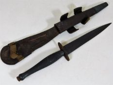 A Fairbairn Sykes commando dagger with sheath