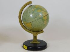 A 1950's Chad Valley tin plate globe
