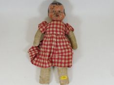 An early 20thC. doll indistinctly signed to nape o
