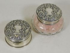 A pair of silver dressing table items