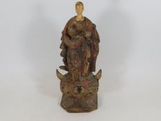 A French 17th polychrome figure standing on the he