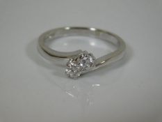 An 18ct gold two stone diamond ring
