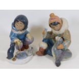 A pair of large Lladro gres Eskimo figures 2361 &