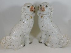 A pair of large 19thC. Staffordshire spaniels appr