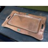 An arts & crafts hammered copper tray with abalone