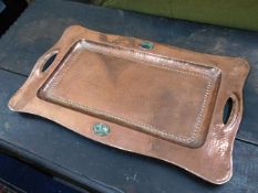An arts & crafts hammered copper tray with abalone