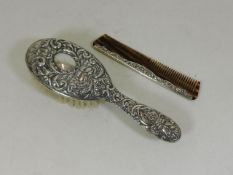 A silver backed brush & comb