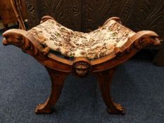 A 19thC. Italian walnut cross stool with lion & ea