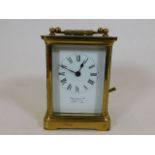 An antique French brass carriage clock Hamilton &