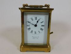 An antique French brass carriage clock Hamilton &