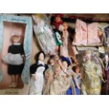 A boxed quantity of dolls house dolls