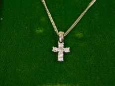 An 18ct gold & diamond crucifix with chain