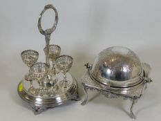 A silver plated egg cup set twinned with similar m