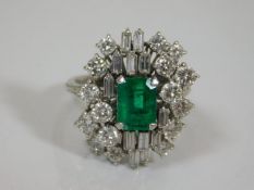 A substantial high carat white gold diamond & emerald ring with approx. 3ct diamond & 1.5ct emerald