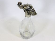 An early 20thC. glass decanter with a silver plate