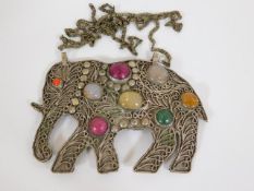 An Asian white metal bejewelled elephant pendant