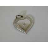 A white gold charm set with diamond