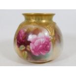 A gilded Royal Worcester pot with roses