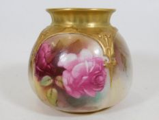A gilded Royal Worcester pot with roses