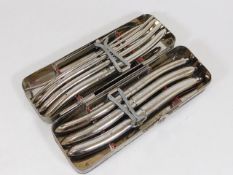 A steel boxed set of Holborn surgical tools