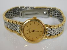 A ladies Omega De Ville two tone wrist watch