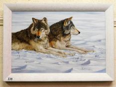 A framed Kim Holweg oil on panel of wolves in snow