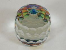 A Swarovski crystal paperweight twinned with a Spe