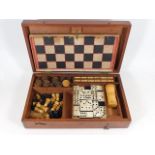 A 19thC. games travel box featuring draughts, ches